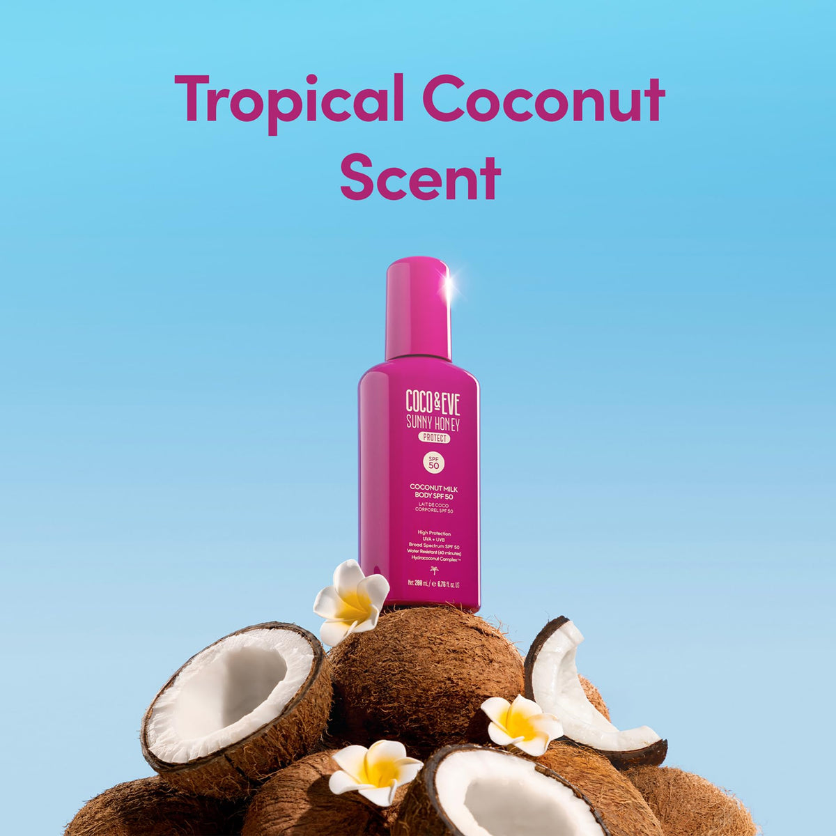 Coco & Eve Coconut Milk Body Sunscreen SPF 50 bottle on a beach