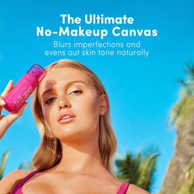 Coco & Eve Face Tanning Micromist misting on skin for even application