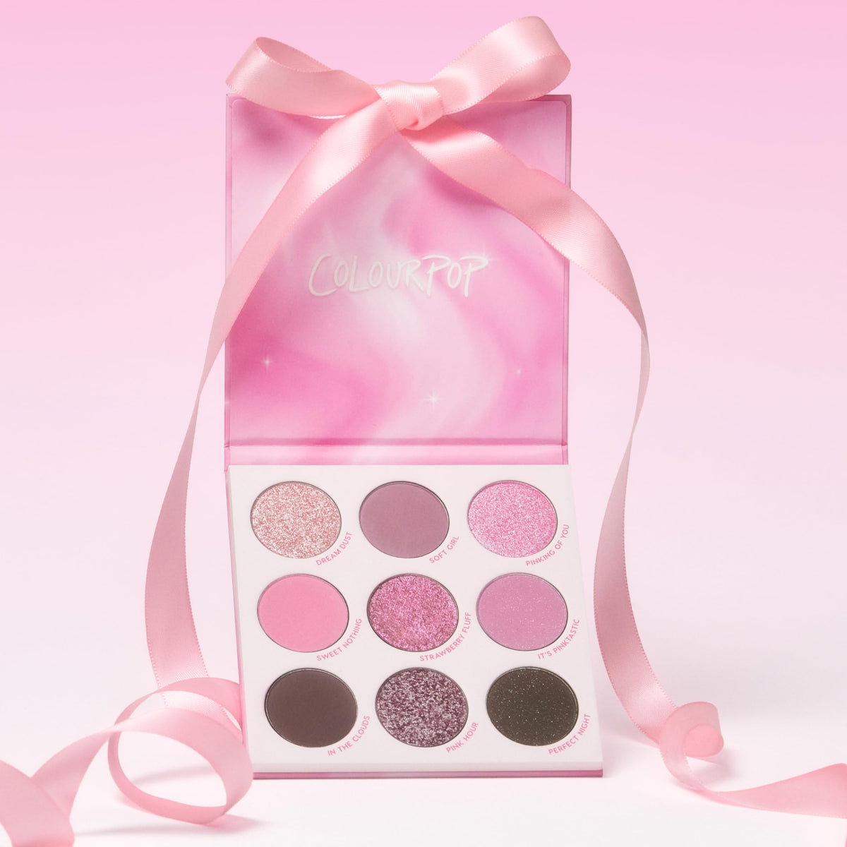 ColourPop Pink Dreams Eyeshadow Palette on vanity with makeup tools