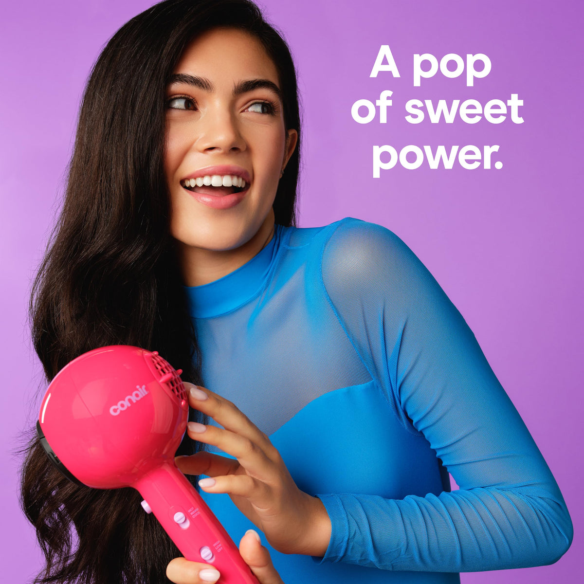 Conair Cake Pop Hair Dryer on a vanity with styling products