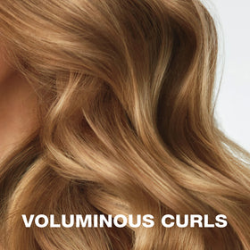Conair Heatless Curls rollers with hair wrapped around for styling