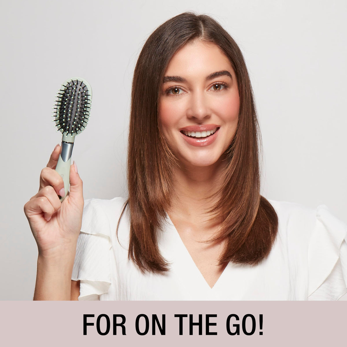 Conair Velvet Touch Oval Cushion Hair Brush showing soft-touch handle