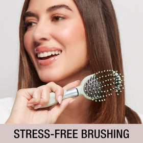 Conair Velvet Touch Oval Cushion Hair Brush side view with ball-tipped bristles