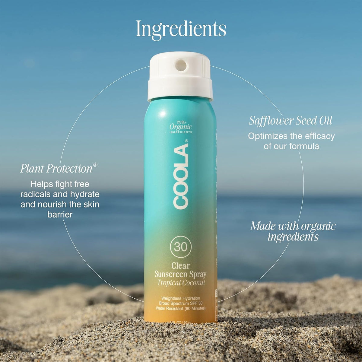 COOLA Organic Sunscreen SPF 30 Spray displayed with sun hat and sunglasses