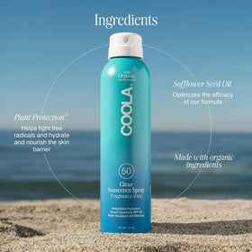 COOLA Organic Sunscreen SPF 50 Spray 6 Fl Oz on a beach