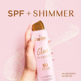 Coppertone Glow Shimmering Sunscreen Spray SPF 50 in use outdoors