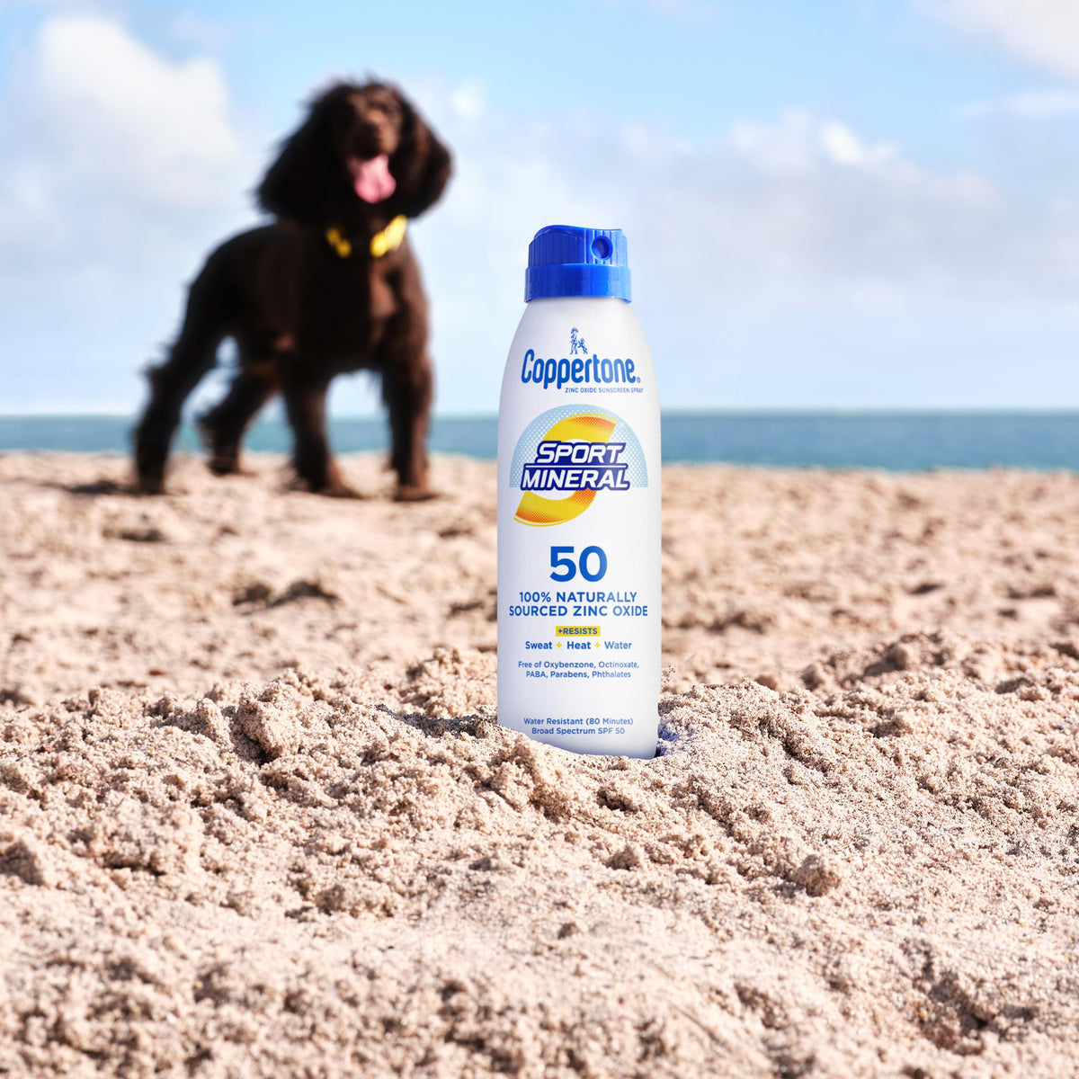 Coppertone Sport Mineral Sunscreen Spray SPF 50 on a beach bag