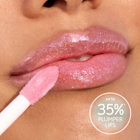 COVERGIRL lip gloss with a mint leaf background