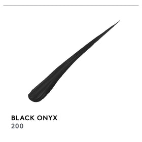 COVERGIRL Perfect Point Plus Liquid Eyeliner Black Onyx on a makeup table