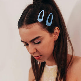 Cptots hair clips arranged to display their secure snap feature