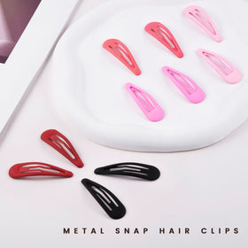 Cptots small hair barrettes in red colour on a white background