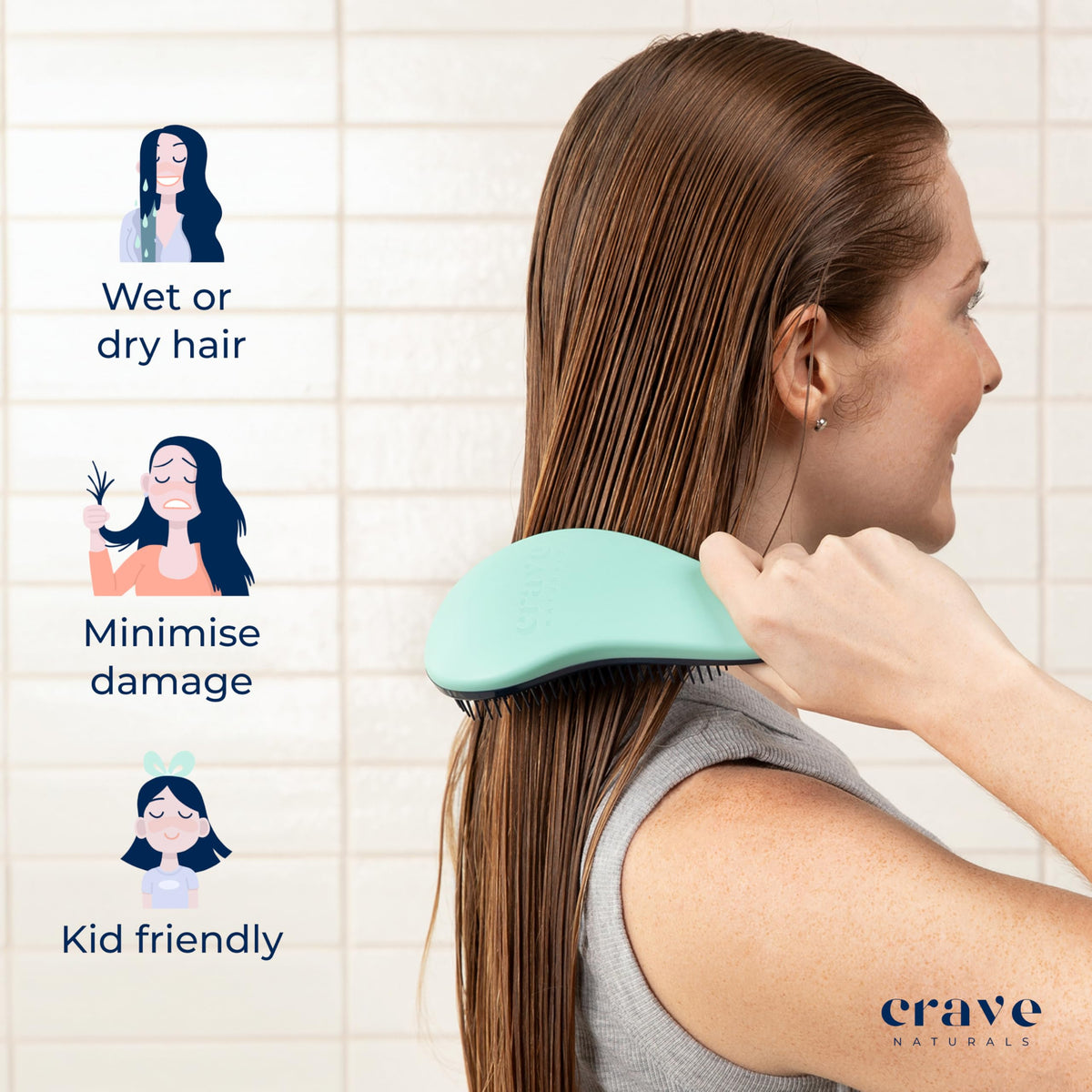 Crave Naturals Biggie Glide Thru Hair Brush held in hand for scale