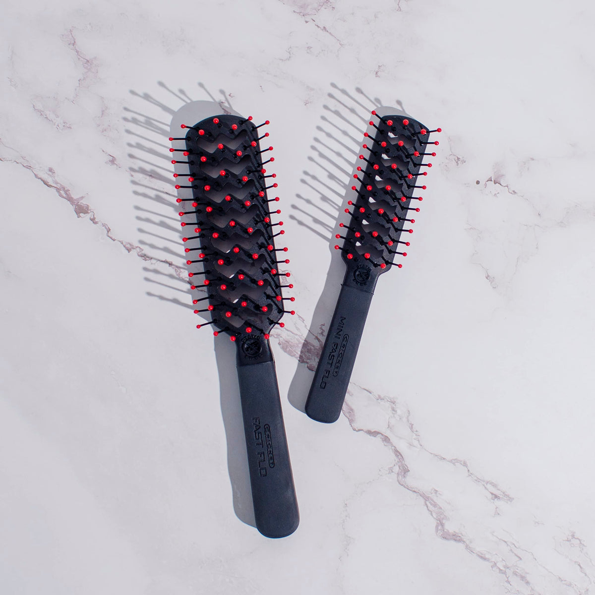Cricket Mini Fast Flo Vent Hair Brush in a travel bag