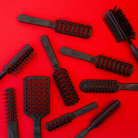 Cricket Mini Fast Flo Vent Hair Brush in use on wet hair