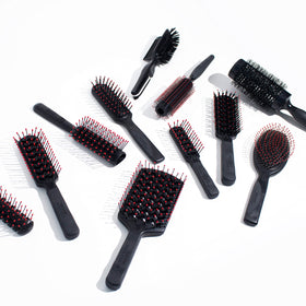 Cricket Mini Fast Flo Vent Hair Brush on a bathroom counter