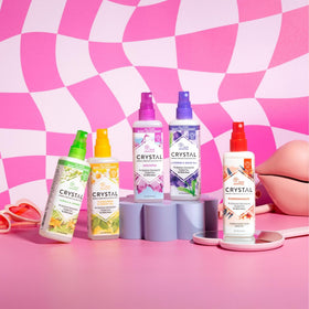 Crystal Essence Deodorant Spray 4 fl oz in hand
