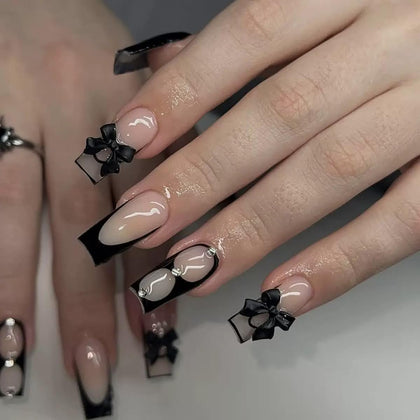 CTTHNBD black French tip press on nails with bow rhinestone design front view
