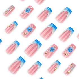 CTTHNBD Medium Press on Nails blue French tip with flower design