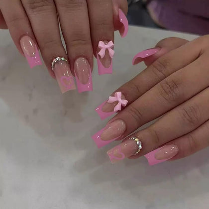 CTTHNBD Pink French Tip Press on Nails front view with bow charms