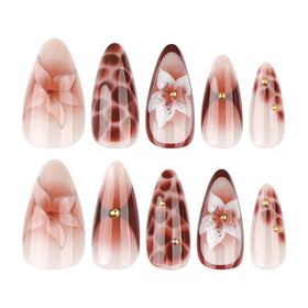 CTTHNBD press on nails displayed on a wooden background