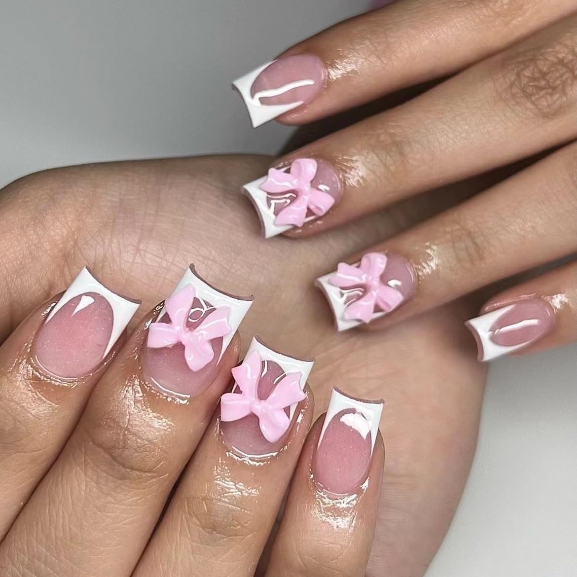 CTTHNBD White French Tip Press on Nails Medium front view with pink bow design