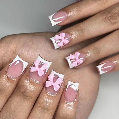 CTTHNBD White French Tip Press on Nails Medium front view with pink bow design
