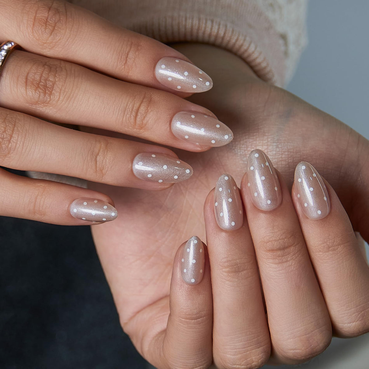 CurvLife Extra Short Almond Press On Nails displayed on a hand