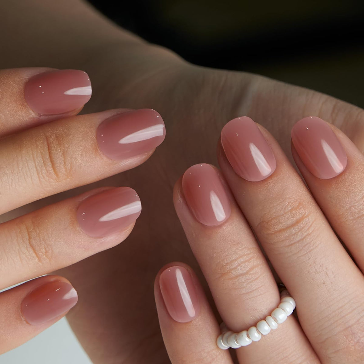 CurvLife Extra Short Oval Press On Nails displayed with nail glue and file
