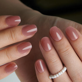 CurvLife Extra Short Oval Press On Nails displayed with nail glue and file