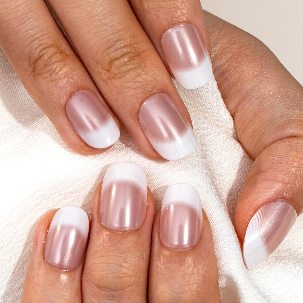 CurvLife Extra Short Square French Tip Press On Nails displayed on a hand
