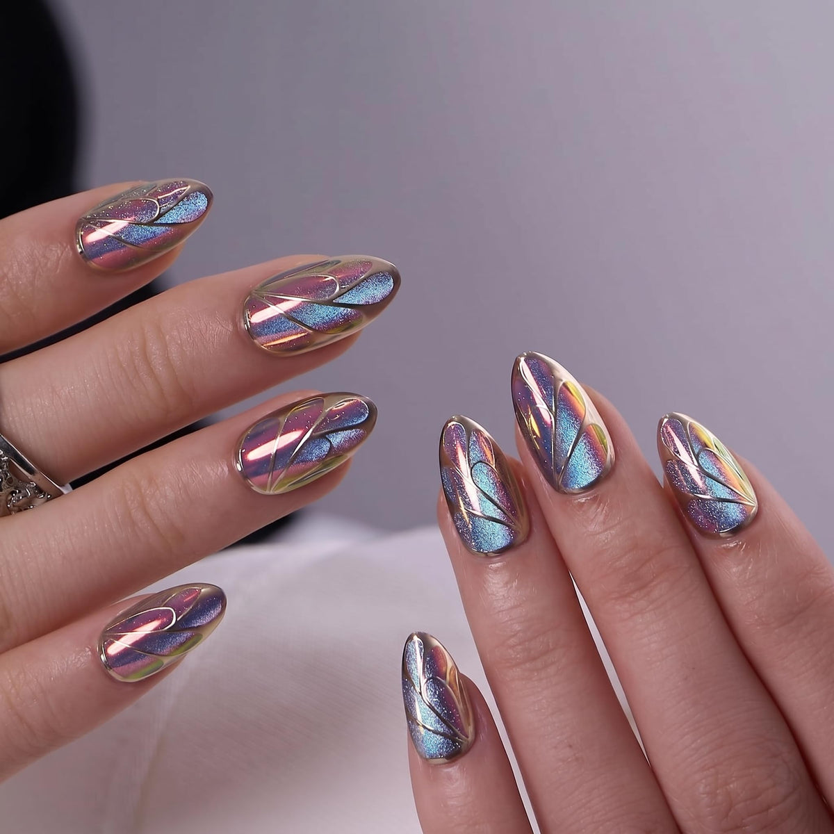 CurvLife Medium Almond Cat Eye Press On Nails displayed on a hand