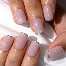 CurvLife press on nails alongside a nail file and cuticle stick