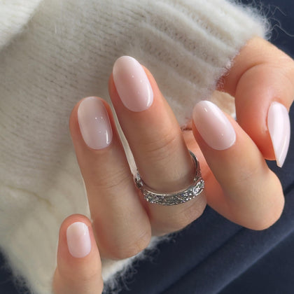 CurvLife Short Oval Nude Press On Nails front view with gradient glow