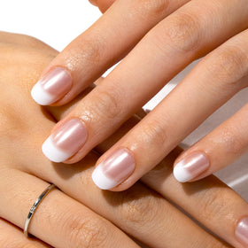 CurvLife Short Square French Tip Press On Nails displayed with cuticle stick