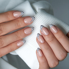 CurvLife Soft Gel Press On Nails close-up showing black polka dots