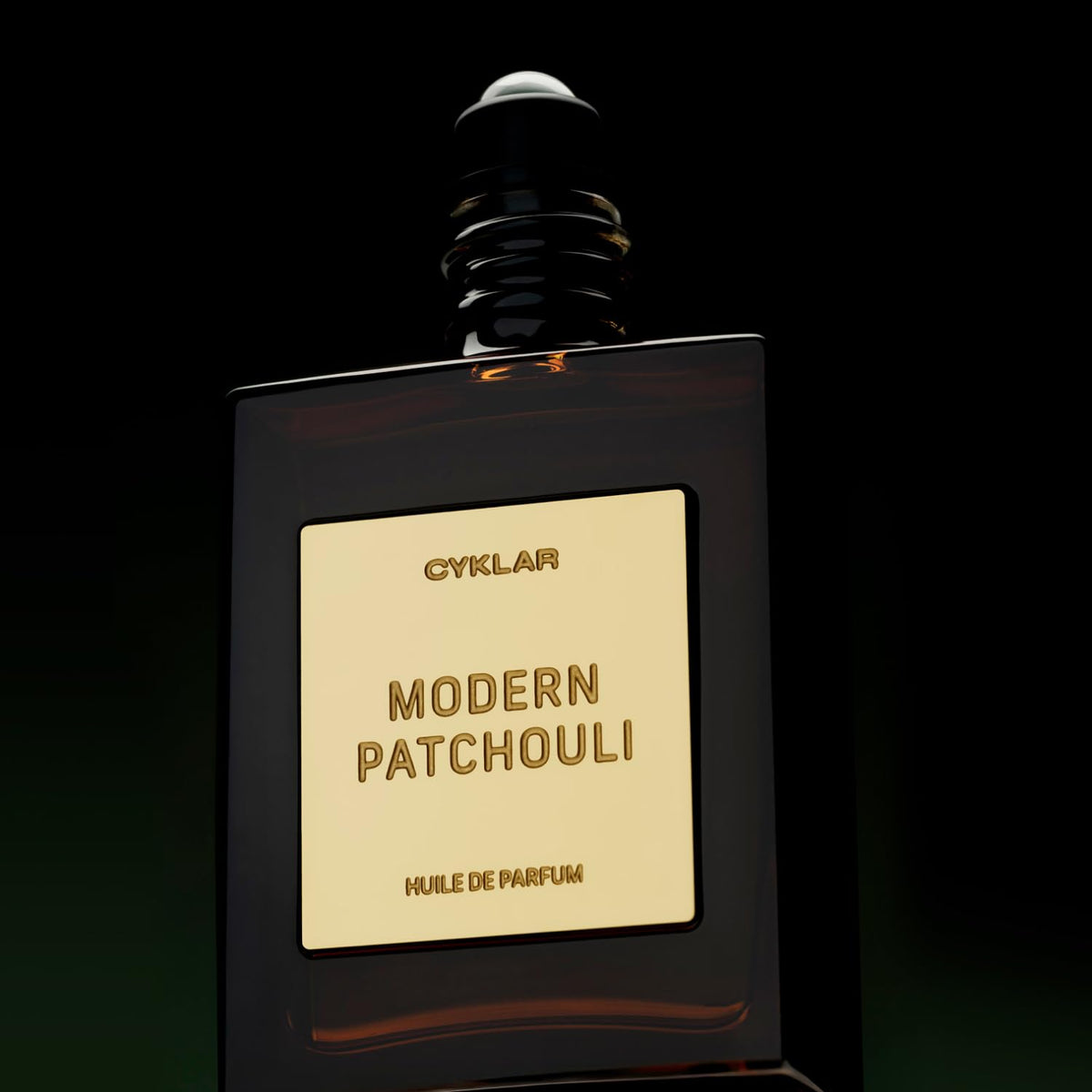 CYKLAR Perfume Oil 15ml bottle with a soft-focus background