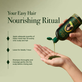 Dabur Amla Hair Oil 500ml bottle on a wooden surface