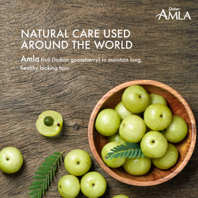 Dabur Amla Hair Oil 500ml lifestyle scene with hair care