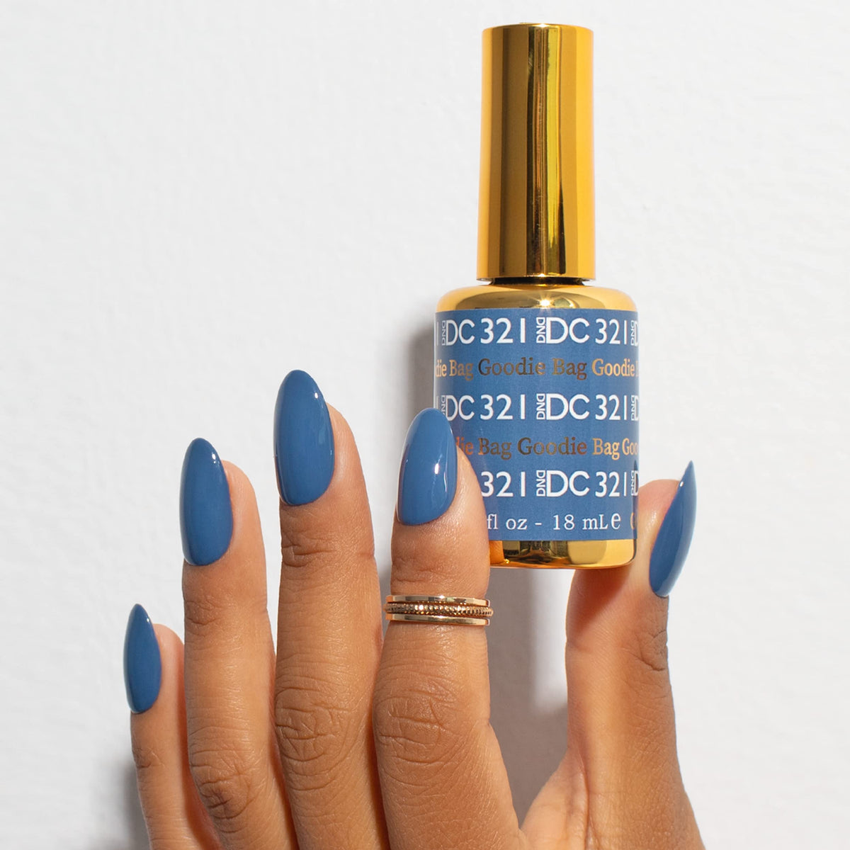 DAISY DND Gel Nail Polish 15ml bottle with dusty denim blue