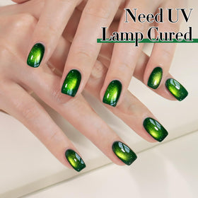 Dark green holographic gel polish application on nails