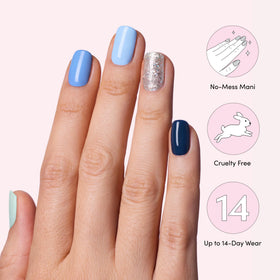 Dashing Diva Gloss Nail Strips in use on manicured hands