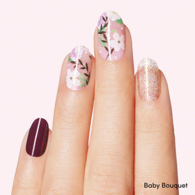 Dashing Diva nail strips showing glossy finish and floral designs