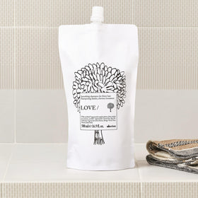 Davines LOVE SMOOTHING Shampoo refill on a bathroom shelf