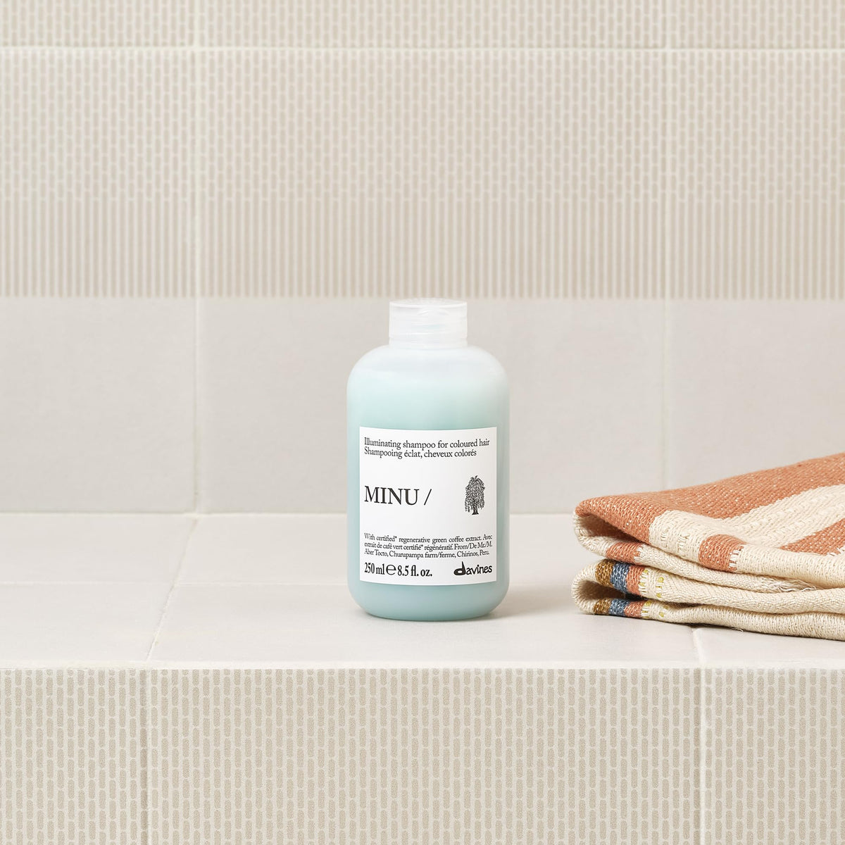 Davines MINU Shampoo in a bathroom setting