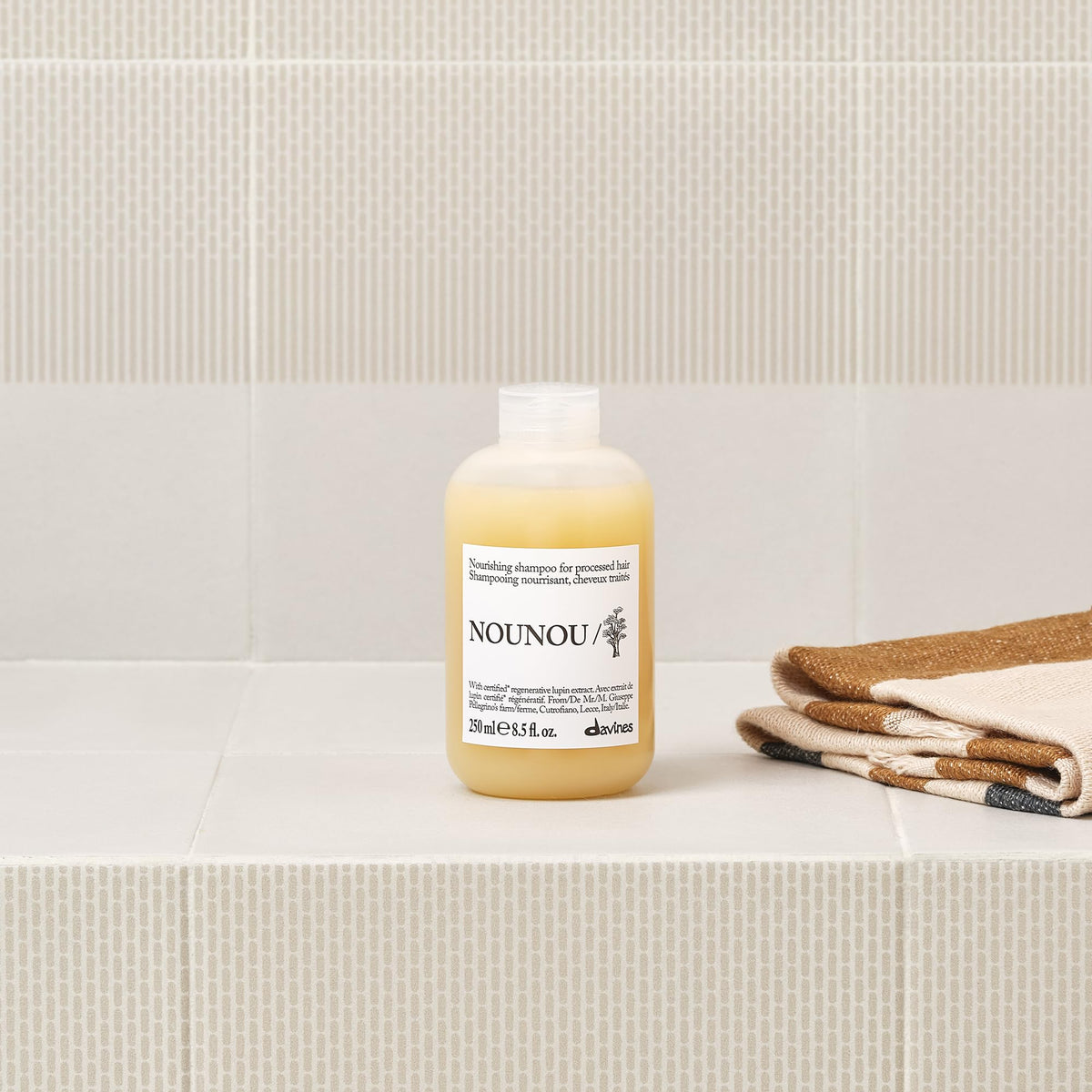 Davines NOUNOU Shampoo with a vibrant hair model