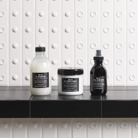 Davines OI Shampoo 330g with a towel and hairbrush