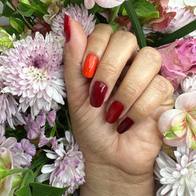 Dazzle Dry Mini Lacquer in red with subtle magenta shimmer