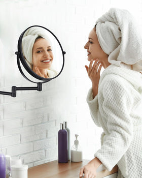 DECLUTTR Wall Mounted Makeup Mirror demonstrating adjustable angle