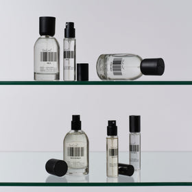 DedCool Fragrance 02 travel size perfume next to a travel bag