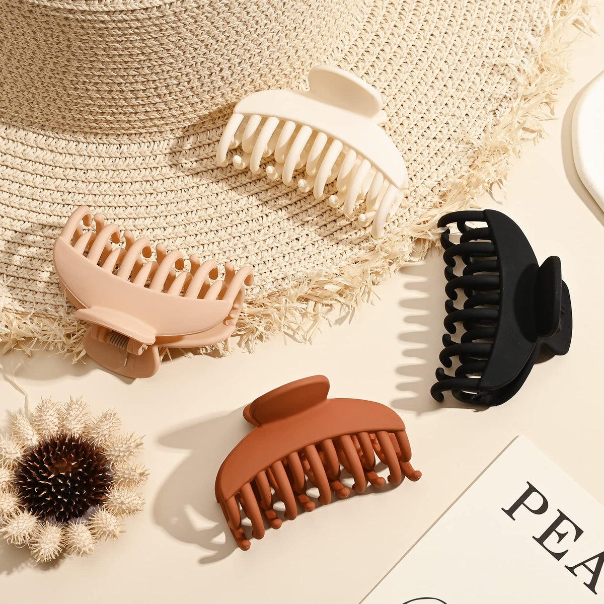 DEEKA Hair Claw Clip in matte brown on a flat surface